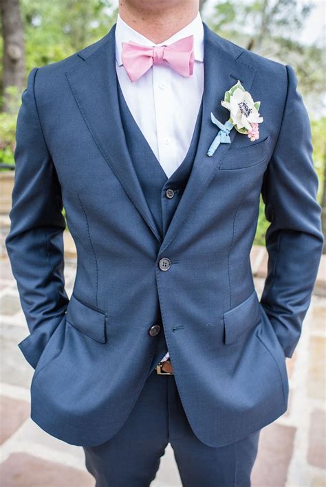 pink tie navy blue suit
